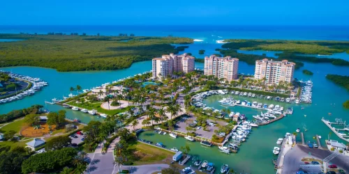 Aerial Drone Photo Showing a Pass from the Bay to the Gulf of Mexico in Naples, Florida with Real Estate in the Foreground