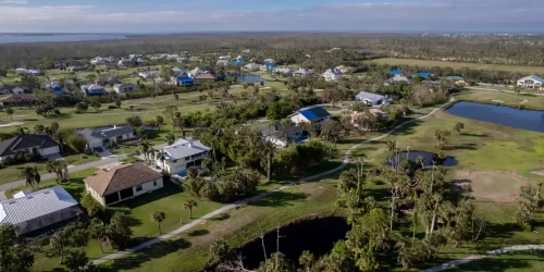Hurricane Ian destroyed homes in Florida residential area on golf course. Natural disaster and its consequences